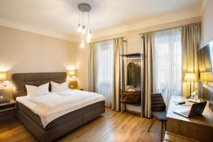 Postel nebo postele na pokoji v ubytování Boardinghouse Pfarrkirchen + 37 fotografií