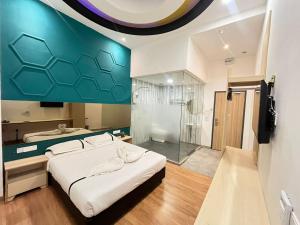 Postel nebo postele na pokoji v ubytování Smile Hotel Wangsa Maju