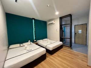 Postel nebo postele na pokoji v ubytování Smile Hotel Wangsa Maju