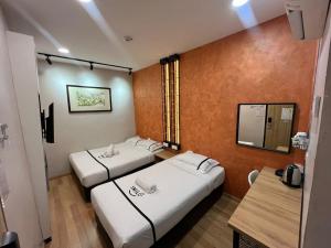 Postel nebo postele na pokoji v ubytování Smile Hotel Wangsa Maju