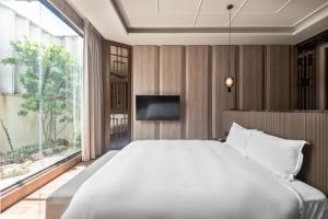 Postel nebo postele na pokoji v ubytování Ease Motel