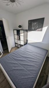 Ένα ή περισσότερα κρεβάτια σε δωμάτιο στο 3 Dimensions Bremen
