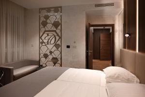 Postel nebo postele na pokoji v ubytování Diamond Hotel