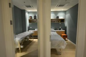Postel nebo postele na pokoji v ubytování Artist Hotel - an Atlas Boutique Hotel