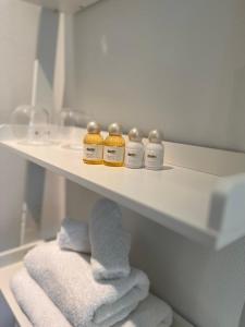 a shelf with four bottles of medicine on it at Sonniges Hinterhaus OG Innenstadt in Osnabrück +12 photos