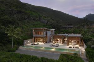 an aerial view of a house with a villa at Six Senses Con Dao - Turtle Island Paradise in Con Dao
