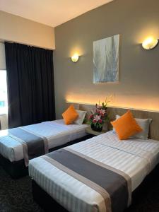 Ένα ή περισσότερα κρεβάτια σε δωμάτιο στο Greenlast Hotel