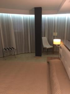 Postel nebo postele na pokoji v ubytování Hotel Teruel