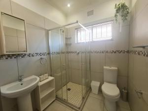 a bathroom with a toilet and a sink and a shower at Riverglades 1 in Margate
