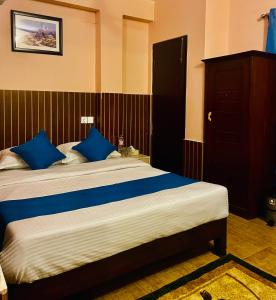Łóżko lub łóżka w pokoju w obiekcie Hotel White Yak