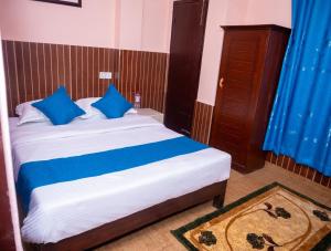 Łóżko lub łóżka w pokoju w obiekcie Hotel White Yak