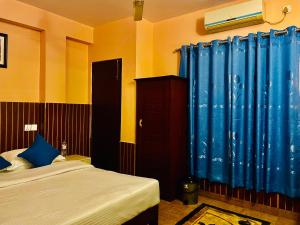 Łóżko lub łóżka w pokoju w obiekcie Hotel White Yak