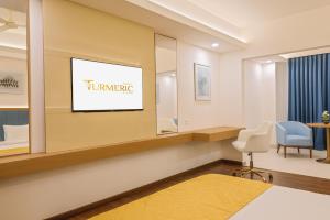 Postel nebo postele na pokoji v ubytování Hotel Turmeric