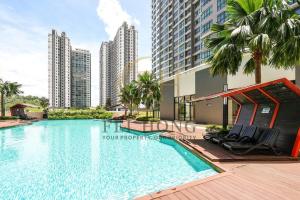 a swimming pool in a city with tall buildings at IOICityMall #Muji#Tatami#Babycot#Conezion#New in Kampong Abu Bakar