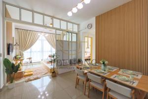 a large dining room with a table and chairs at IOICityMall #Muji#Tatami#Babycot#Conezion#New in Kampong Abu Bakar