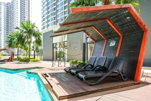 a group of chairs sitting next to a swimming pool at IOICityMall #Muji#Tatami#Babycot#Conezion#New in Kampong Abu Bakar