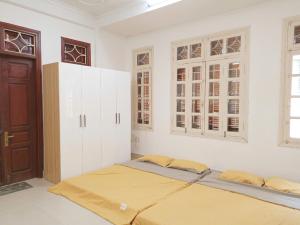 Postel nebo postele na pokoji v ubytování MiMi Homestay Hải Phòng