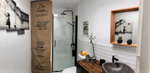 a bathroom with a shower and a sink at The funny Tuna in Zahara de los Atunes