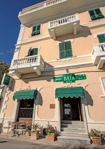 a building with a sign that reads great balla at Hotel Baia in Monterosso al Mare