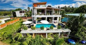 an aerial view of a house with a swimming pool at Lila Villa in Hinkong