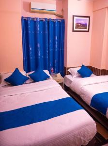 Łóżko lub łóżka w pokoju w obiekcie Hotel White Yak