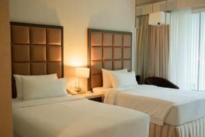 Krevet ili kreveti u jedinici u objektu The Hill Hotel & Resort Sibolangit Powered by Archipelago