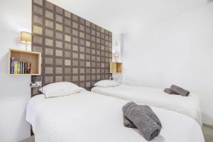 two beds in a small room with white sheets at Sungolfbeach El Girasol in Orihuela +18 photos