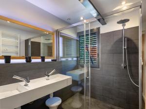 a bathroom with a sink and a shower at Magnifique Chalet Moderne Familial in Font Romeu Odeillo Via +30 photos