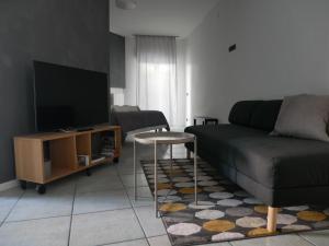 TV a/nebo společenská místnost v ubytování Ratafià