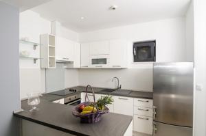 Kuchyň nebo kuchyňský kout v ubytování Apartment Atlant