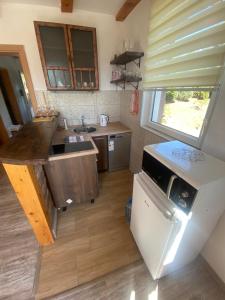 an overhead view of a kitchen with a sink and a stove at Zeleni kutak in Sarajevo