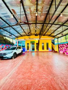 a garage with a car parked in the middle at Beach haven Kattankudy in Kattankudi