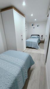 En eller flere senge i et værelse på Apartamento Bellaluz 0505 Resort Golf La Manga Club + 55 billeder