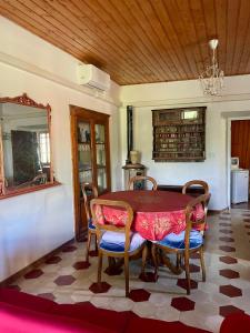 a dining room with a table and chairs at Tabernacolo in Carpineta