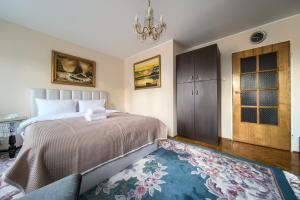 Posteľ alebo postele v izbe v ubytovaní Szczepin Spacious Apartment