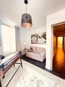 a living room with a couch and a table at Penthouse Traum - Blick über Arnstadt in Arnstadt