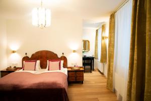 Rúm í herbergi á Austria Classic Hotel Wolfinger - Hauptplatz