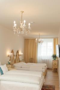 Rúm í herbergi á Austria Classic Hotel Wolfinger - Hauptplatz