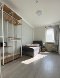 a bedroom with a bunk bed and a window at Ferienwohnung Freedom 1 Sky Terrasse High End in Northeim