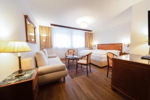 Rúm í herbergi á Austria Classic Hotel Wolfinger - Hauptplatz