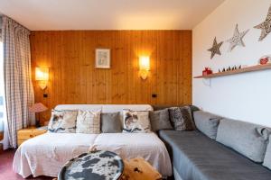 Ένα ή περισσότερα κρεβάτια σε δωμάτιο στο Appartement Le Creux de l'Ours
