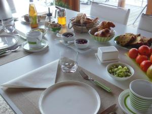a table with plates of food on a table at Les perrelles in Bellecombe-en-Beauges +37 photos