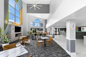 an open kitchen and dining room with a table and chairs at Quality Inn Commerce at I-85 in Commerce