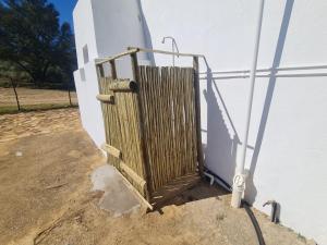 a wooden door on the side of a building at Landsrivier Cottage No 1 in Uniondale