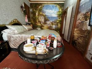a room with a table with food on it at The Mirador Boutique Town House in Swansea +101 photos