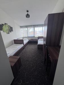 Posteľ alebo postele v izbe v ubytovaní Motel Orion Wolsztyn