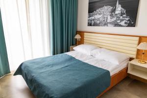 Rúm í herbergi á Hotel Laguna - Terme Krka