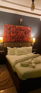 Letto o letti in una camera di Ma'a Lapseu hôtel