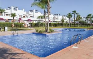 a swimming pool in a apartment with a palm tree at Great Apartment & Golf With Big Roof Terrace in Alhama de Murcia