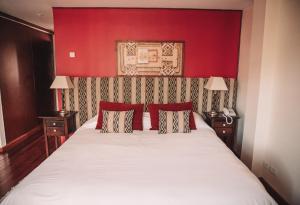 Cama ou camas em um quarto em Hotel Catedral Ski & Wellness